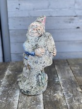 Vintage stone garden statue Gnome holding Fish.