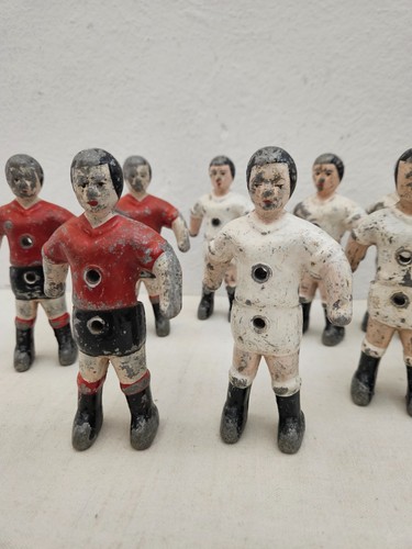 Red and white foosball players - red,