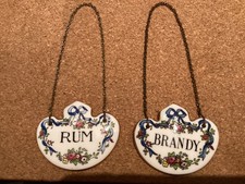 An Attractive Set of Two Fine Bone China Crown Staffordshire Decanter Labels