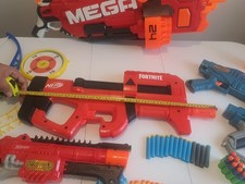 a huge bundle of huge nerf guns , darts and archery