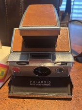 Polaroid SX-70 Land Camera  with film, and case 