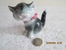 GOEBEL  WEST GERMANY  SMILING  CAT WITH PINK BOW      see des.