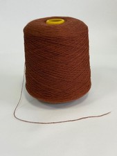 Rust brown yarn on cone  for