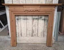 A RECLAIMED VINTAGE PINE FIRE SURROUND WITH CARVED DETAILING FS0412