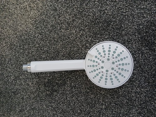 White mira beat shower head - head,