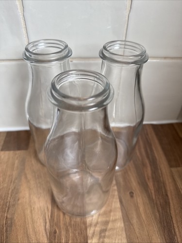 Three glass milk bottles - three,