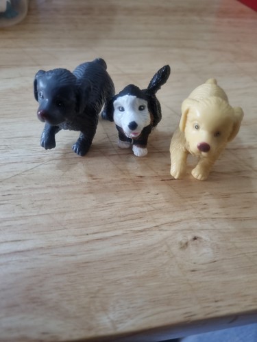 Three small dog figurines - three,