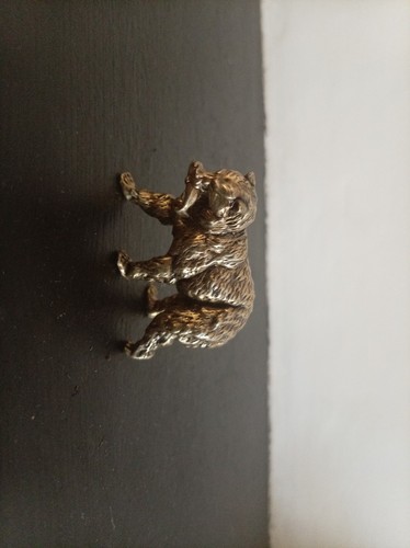 Little brass bear with - bear,