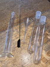 Vintage laboratory glassware measuring cylinder, test tubtest tubes, funnel