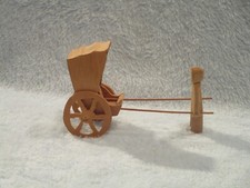 Chinese Male Pulling a Covered