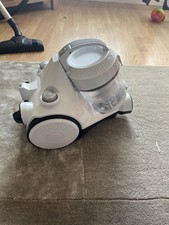 vacuum cleaner — a household device used to clean floors, carpets, and furniture