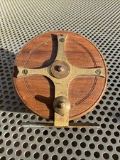 VINTAGE FISHTAIL BRASS STARBACK WOODEN FISHING REEL.