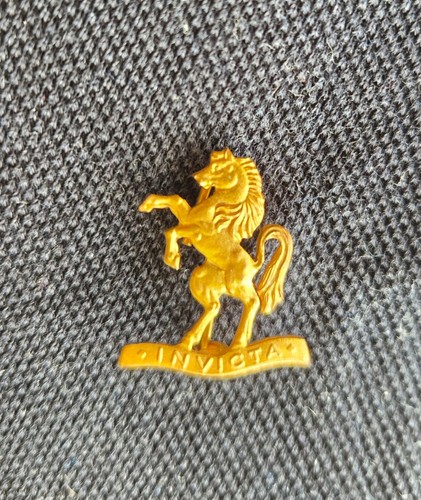 Brass invicta badge - invicta,