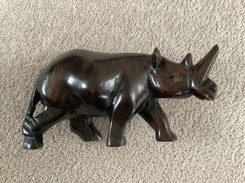 Hand carved wooden rhino - hand,