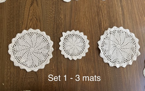 Hand crocheted mats in - hand,