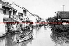 F006560 Indonesia Java Batavia Boats float along the canal 1930