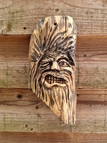 Chainsaw carved green man - chainsaw,