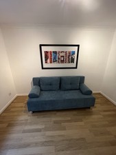 Blue 2 Seater Click Clack Sofa Bed With Storage For Sale. Was Used Once