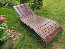 Lovely vintage forged iron garden lounger with wood slats. Elegant curled legs.