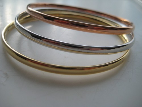 Gold slave bangle set - 9, carat