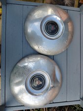 Pair of vintage car hub caps -