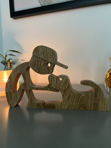 Wooden dog and owner - and,