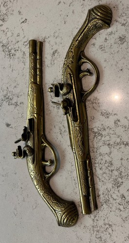 Vintage old brass pistols - old,