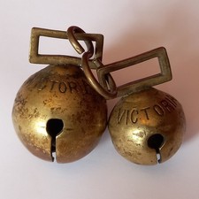 TWO ANTIQUE BRASS HORSE CROTAL