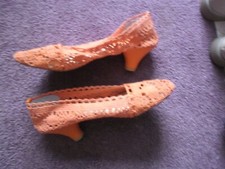 Orange heeled shoes