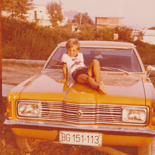 Boy sitting yellow ford - boy,