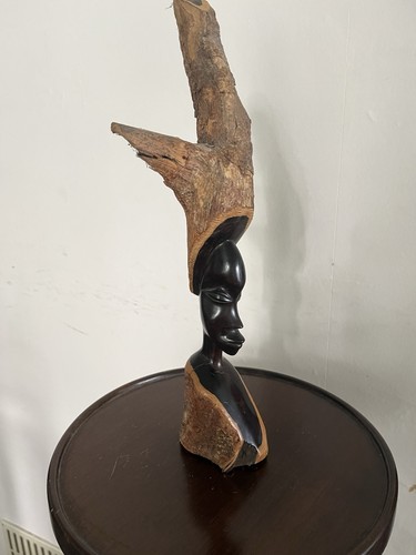 Ebony bust from natural bark
