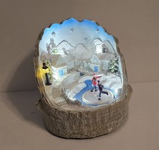 Premier LED Lit Village Scene Ice Skating Christmas Animated Winter Log 18cm