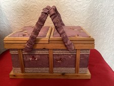 Wooden and material framed portable sewing box.