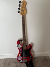 Shine 5-String Electric Bass Guitar in Red with amplifier