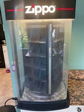 COMMERCIAL ZIPPO DISPLAY CABINET WITH LIT ,REVOLVING COLUMN.