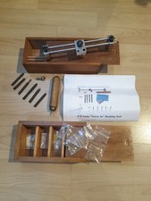 Clockmakers Ayres clock Bushing Tool with an assortment of bushes.