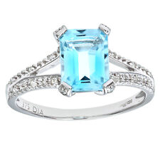 9ct White Gold Emerald Cut Blue Topaz Ring With Diamond Shoulders By Naava