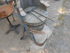 A PAIR OF ANTIQUE WROUGHT IRON GARDEN BENCH ENDS