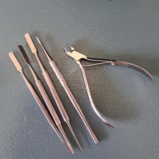 Podiatry,  chiropody tools, 3 spatulas, 1 Blacks file and cuticle  nipper . Used