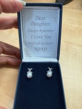 Diamond and cultured pearl - and,