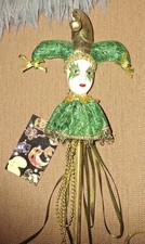 Porcelain jester doll on a