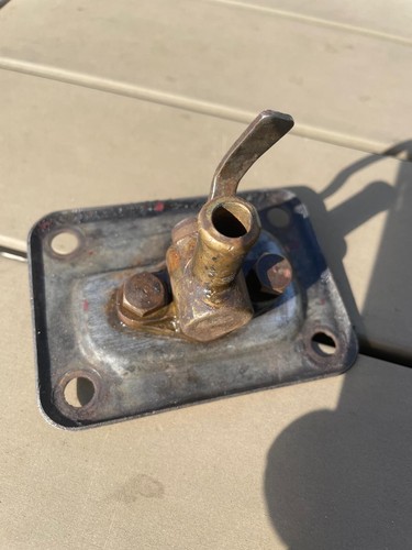 Backplate with integral tap