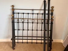 Bed, antique Victorian brass and iron bedstead ends with irons.  Solid condition