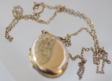 Antique Edwardian rolled gold locket and chain.