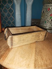 A TRADITIONAL VINTAGE INDIAN WOODEN BRICK MOULD WITH IRON HANDLES