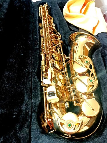 Gold saxophone with cleaning - saxophone,