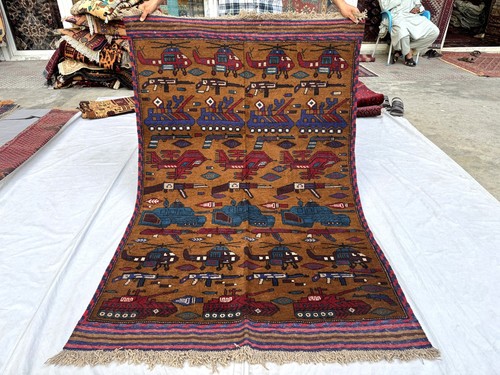 Brown hand knotted afghan - hand,