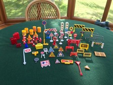 Assorted toy road signs, barrels, barriers, cones and street furniture