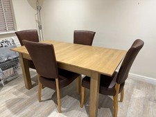 extending oak dining table and