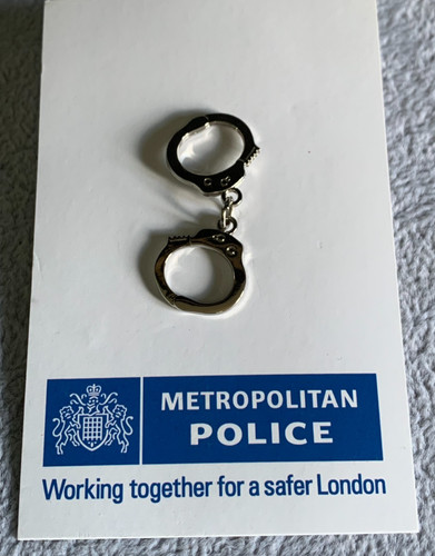 Metropolitan police handcuffs - police,